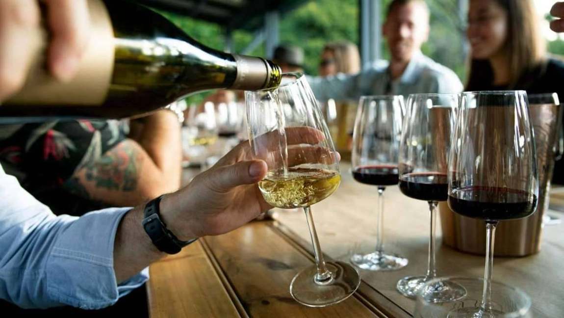 Friends sharing a wine tasting around a table