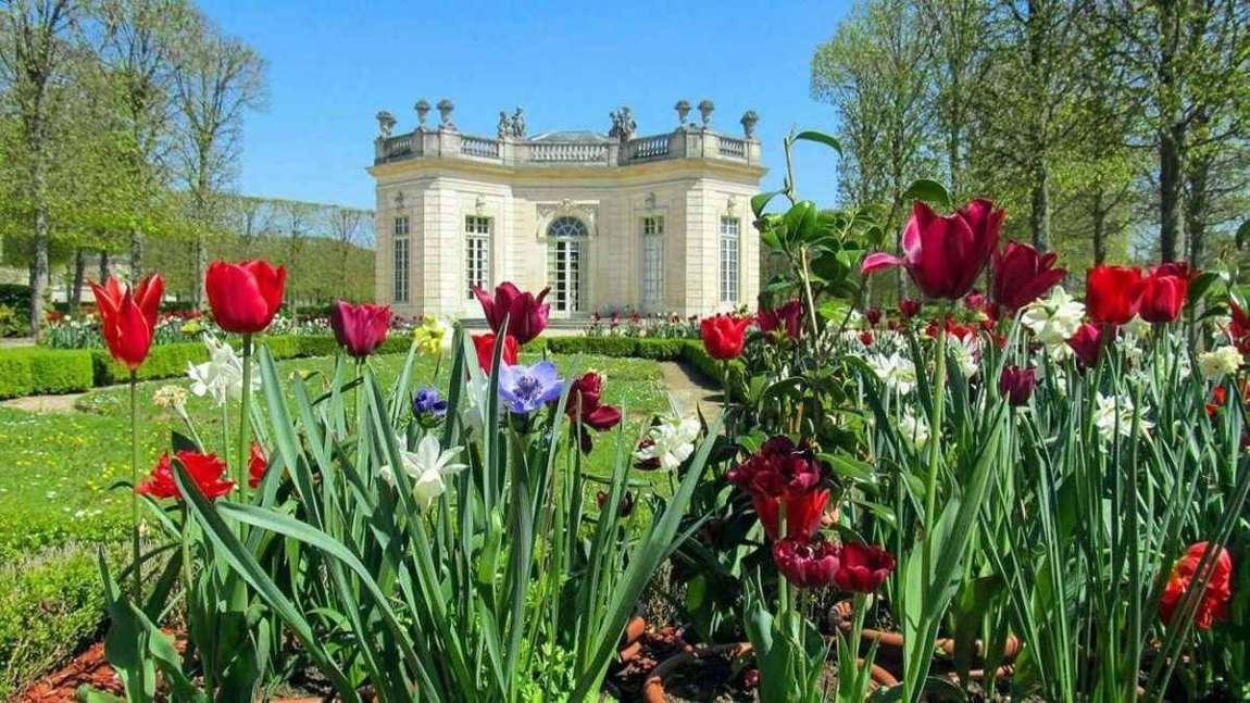 The Temple of Love at the Petit Trianon estate, Versailles, framed by spring flowers